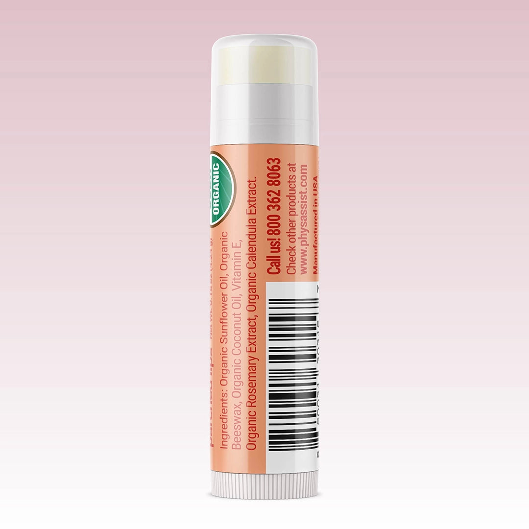Lip balm stick with visible branding on a pink background